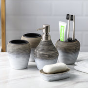 Retro brushed five-piece bathroom wash set featuring ceramic soap dispenser and storage holders.