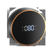 Round black digital thermometer with temperature display, featuring a sleek design and large LED screen.